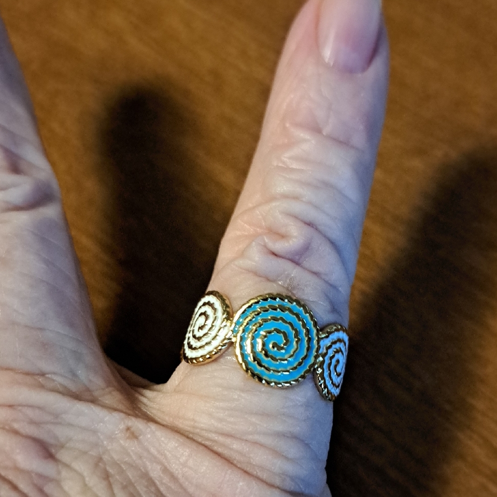Elegant Spiral Gold and Blue Ring